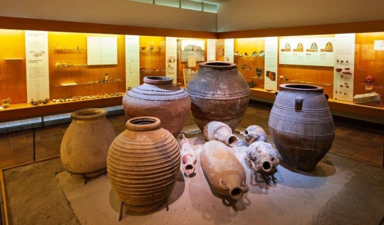 A selection of Roman clay pots on display in a museum