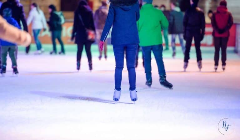 The legs of people ice skating. Northants Families