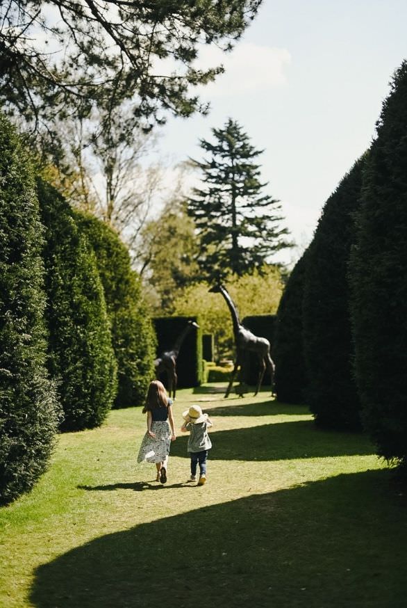 Visitors enjoy a walk through the lush gardens at Knebworth House during the 2026 season reopening.