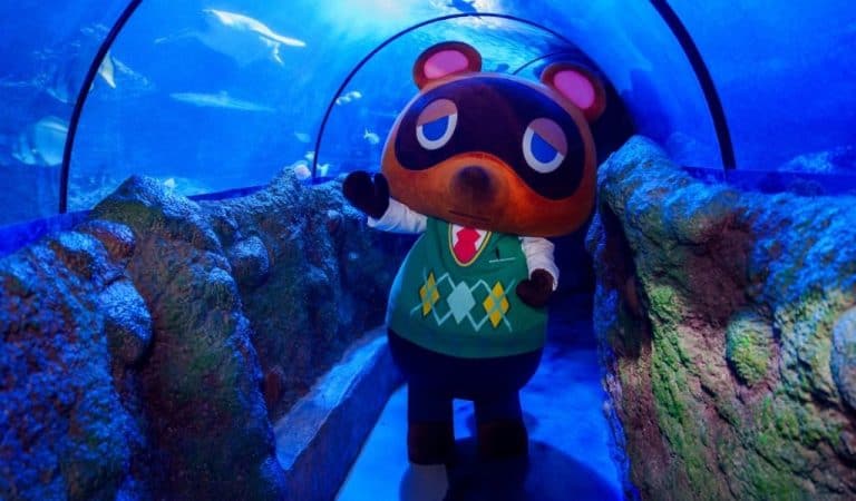 Tom Nook - an Animal Crossing character standing in the tunnel at Birmingham Sea Life centre