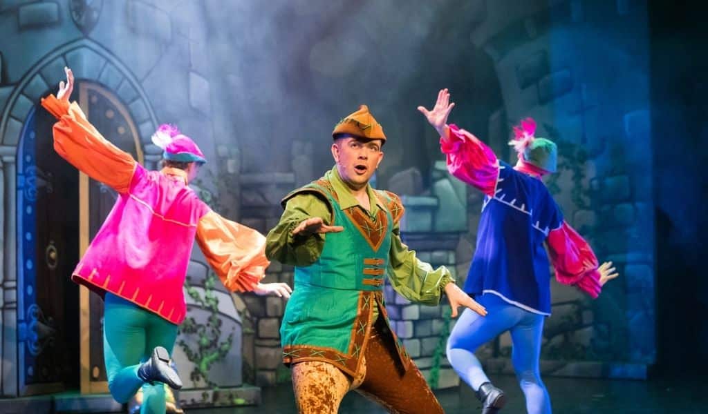 Robin Hood and dancers on stage at KD Theatre's Easter pantomime production