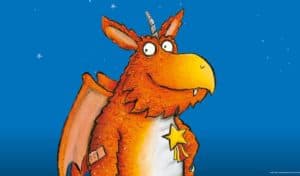 Zog the dragon character illustration from the Julia Donaldson and Axel Scheffler children's book, against a blue starry background