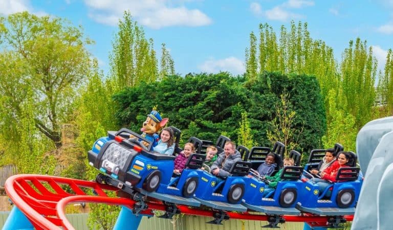 Families riding Chase's Mountain Mission junior roller coaster at World of PAW Patrol Chessington