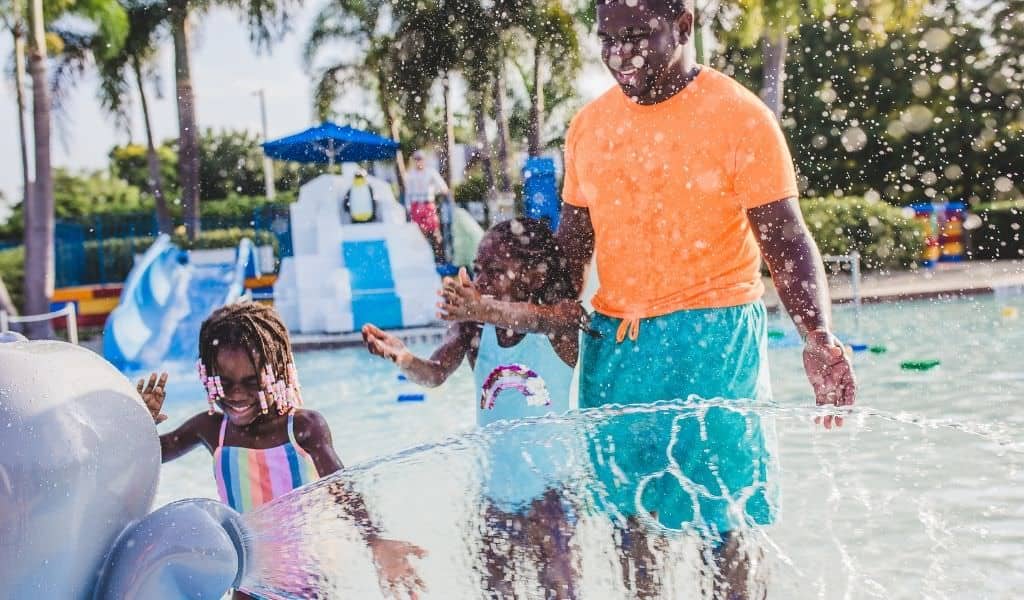Dad and two children at water park
