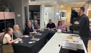 Guests enjoying a cookery masterclass at Bell of Northampton kitchen showroom