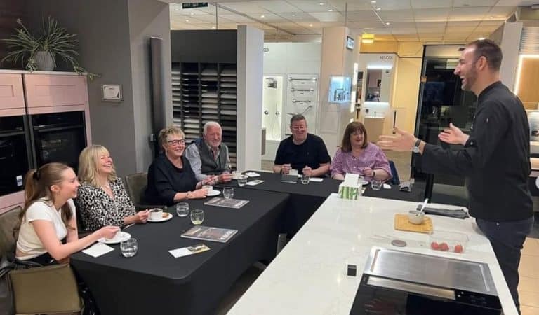 Guests enjoying a cookery masterclass at Bell of Northampton kitchen showroom