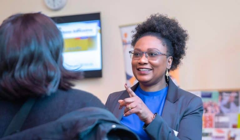 Tutu Alaka, CEO of Bauhaus Education talking to another lady with her back to the camera