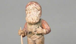 Lampy - the worlds oldest garden gnome, standing on a concrete block,