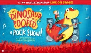 Promotional poster for The Dinosaur That Pooped a Rock Show, showing a boy singing into a microphone while riding a rocking dinosaur playing electric guitar, surrounded by speakers and a cheering crowd silhouette, based on the books by Tom Fletcher and Dougie Poynter.