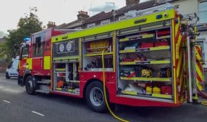 A fire engine with all side cabinets open