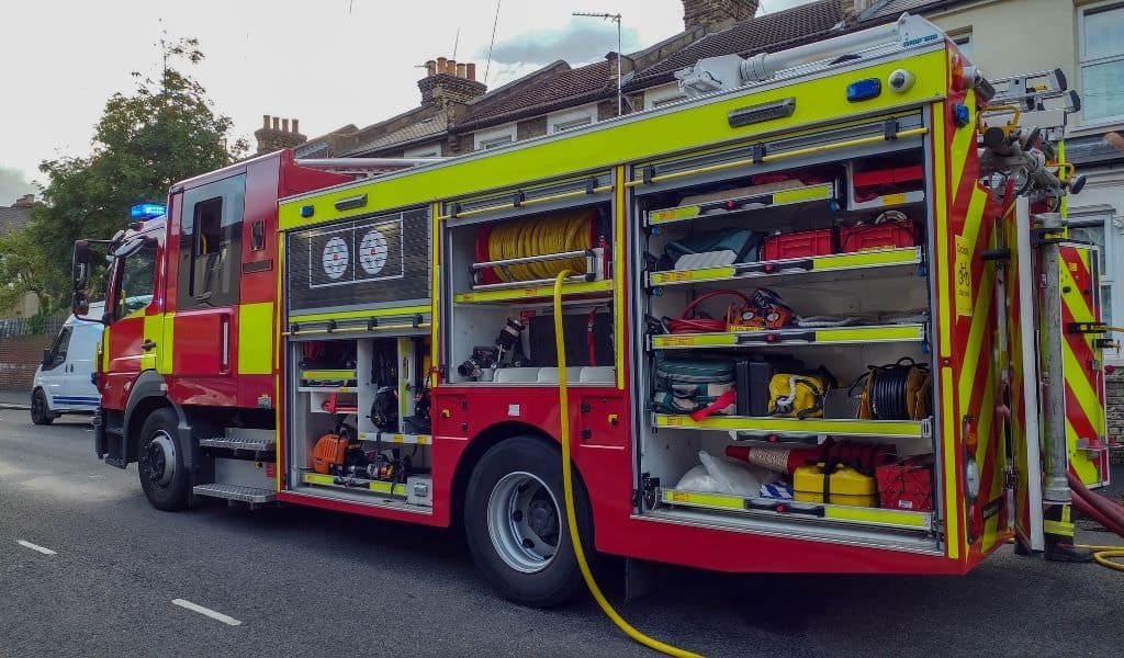 A fire engine with all side cabinets open